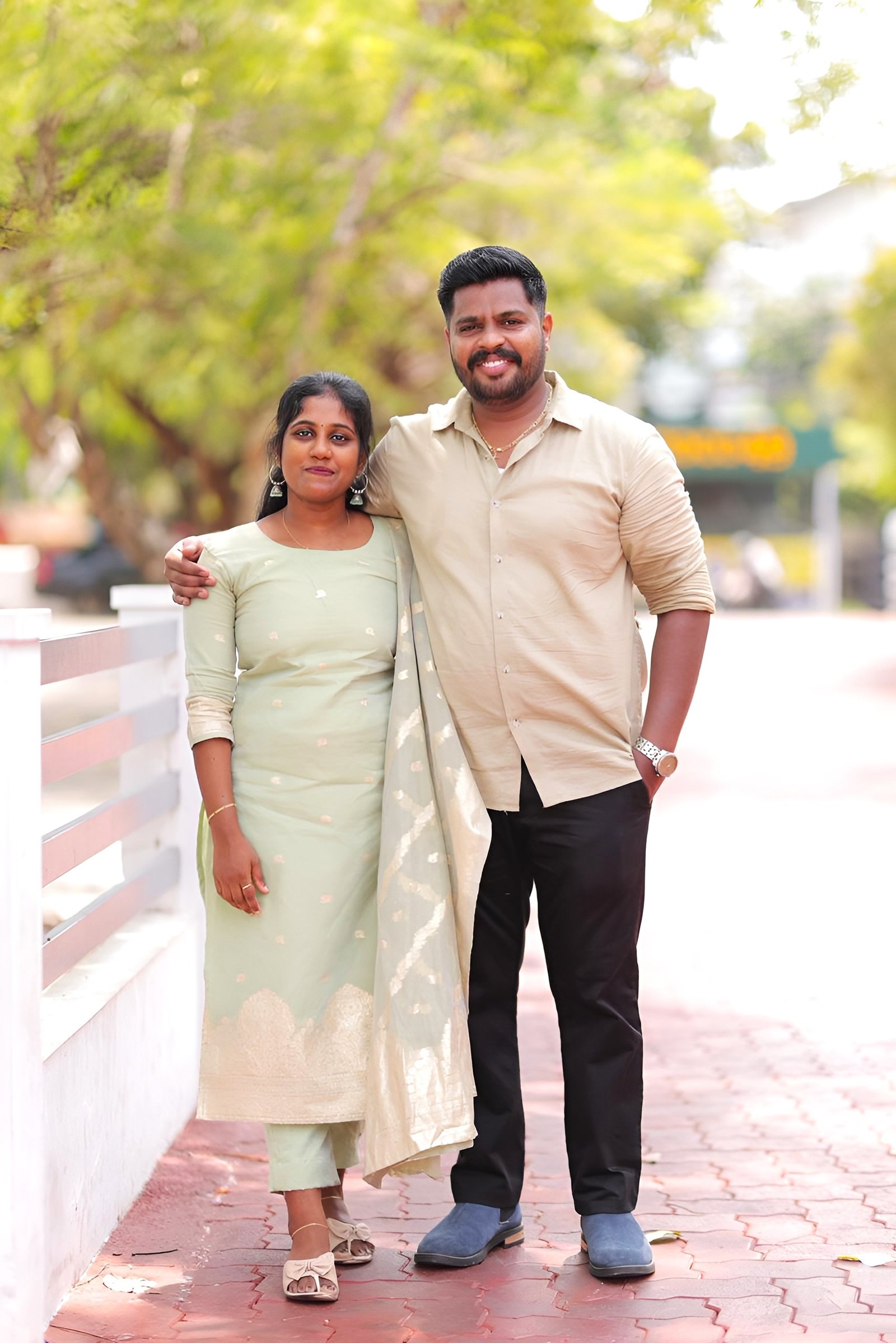 Jereena And Sajith Together On A Tree-Lined Walkway